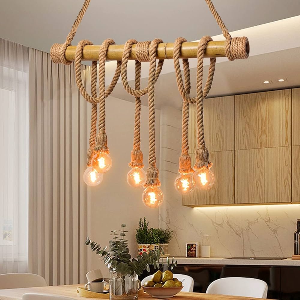 Modern pendant lights hanging over dining table and kitchen island