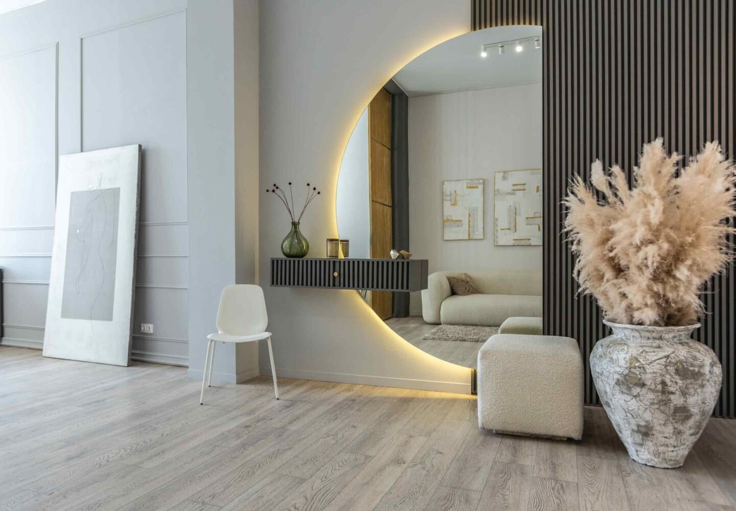 Mirrors in interior design reflecting light and creating a sense of spaciousness in a modern living room