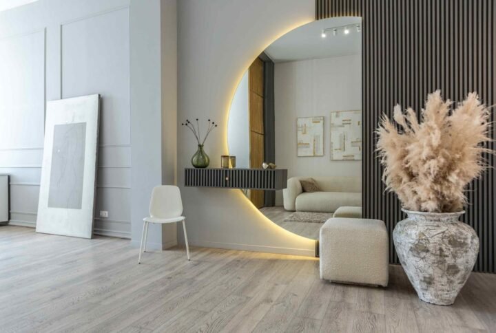 Mirrors in interior design reflecting light and creating a sense of spaciousness in a modern living room