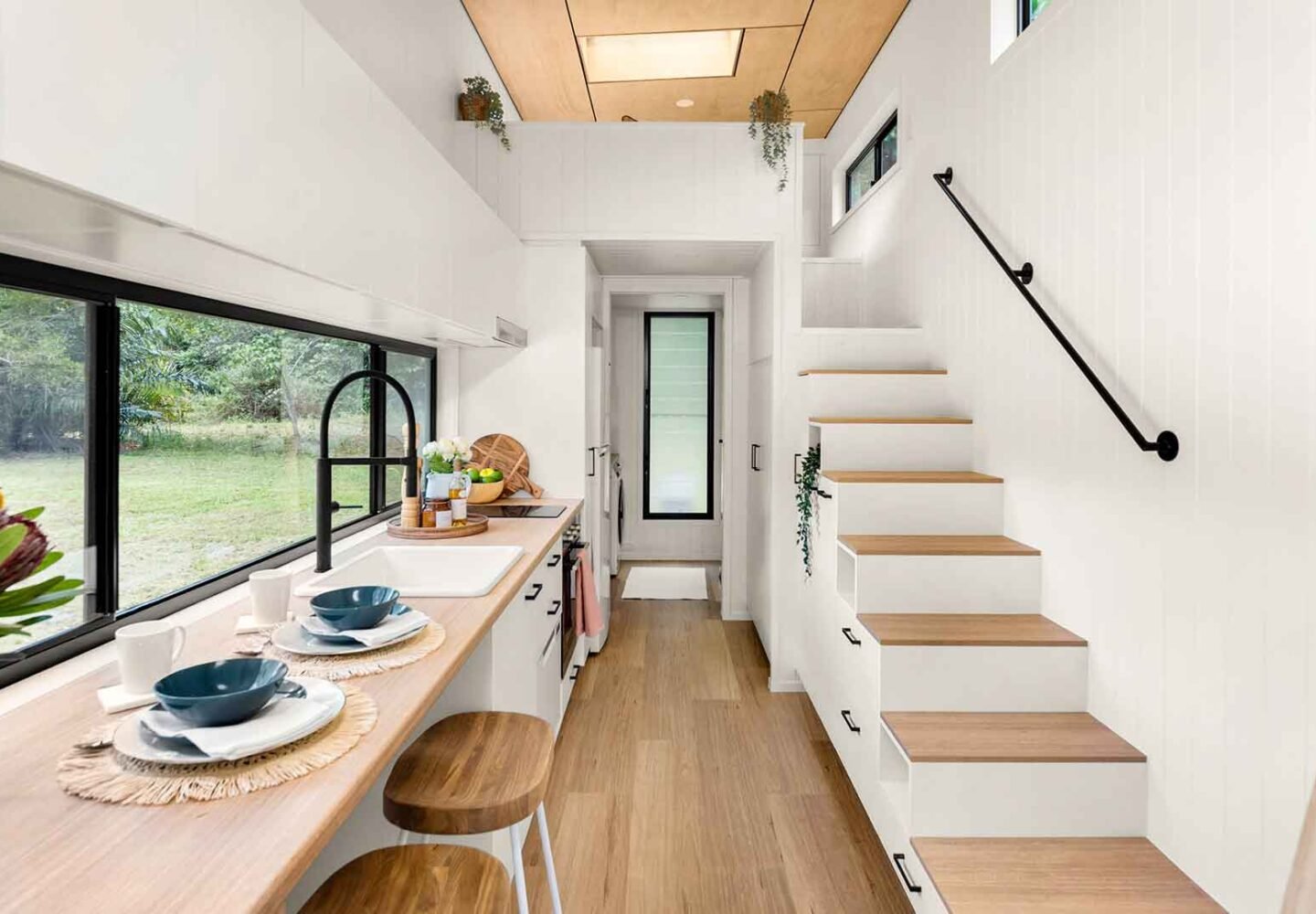 Tiny house decorating ideas featuring smart storage, multifunctional furniture, and modern minimalist design in a small living space