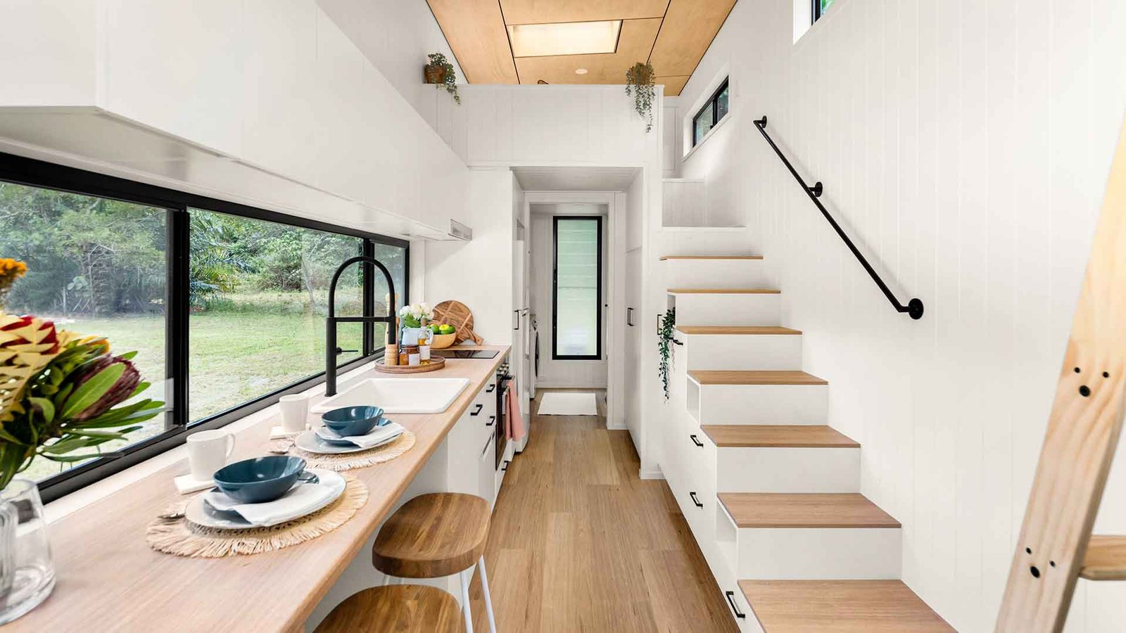 Tiny house decorating ideas featuring smart storage, multifunctional furniture, and modern minimalist design in a small living space