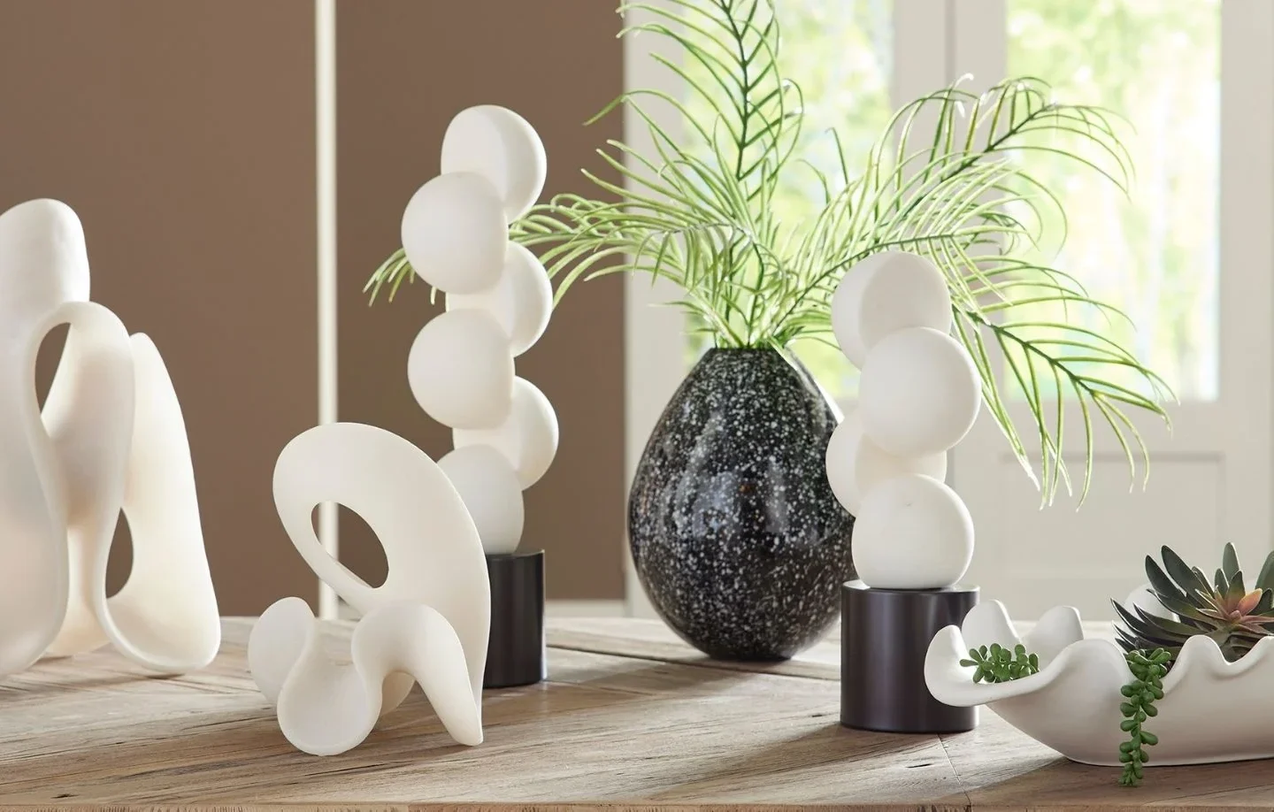 Decorative accessories including art, mirrors, lighting fixtures, plants, and decorative objects for stylish interiors