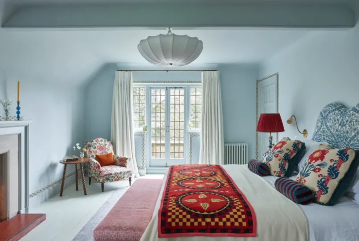 Bedroom styling ideas featuring a modern cozy bedroom with soft lighting, layered textiles, neutral colors, and elegant decor elements