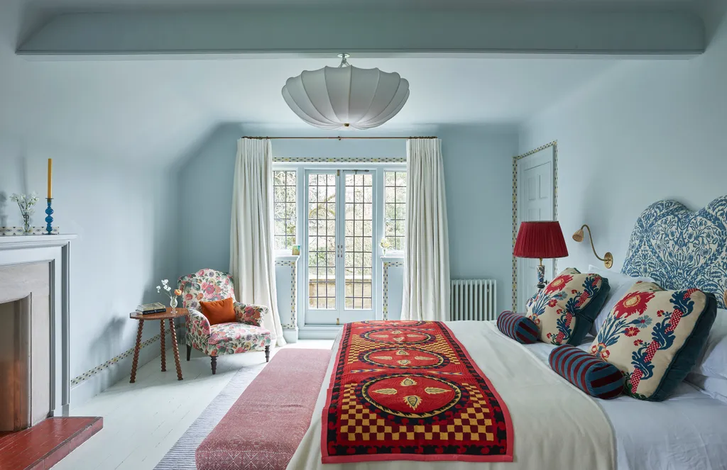 Bedroom styling ideas featuring a modern cozy bedroom with soft lighting, layered textiles, neutral colors, and elegant decor elements